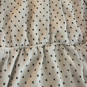 Sleeveless white and black dot dress